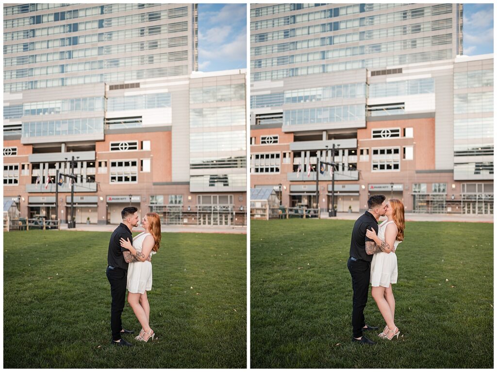 Emma and Nick pose on the lawn in front of Harbourcenter Buffalo 