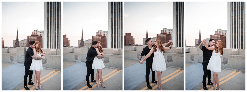 Emma and Nick pose and laugh together during their engagement photos on top of a parking garage in downtown Buffalo NY