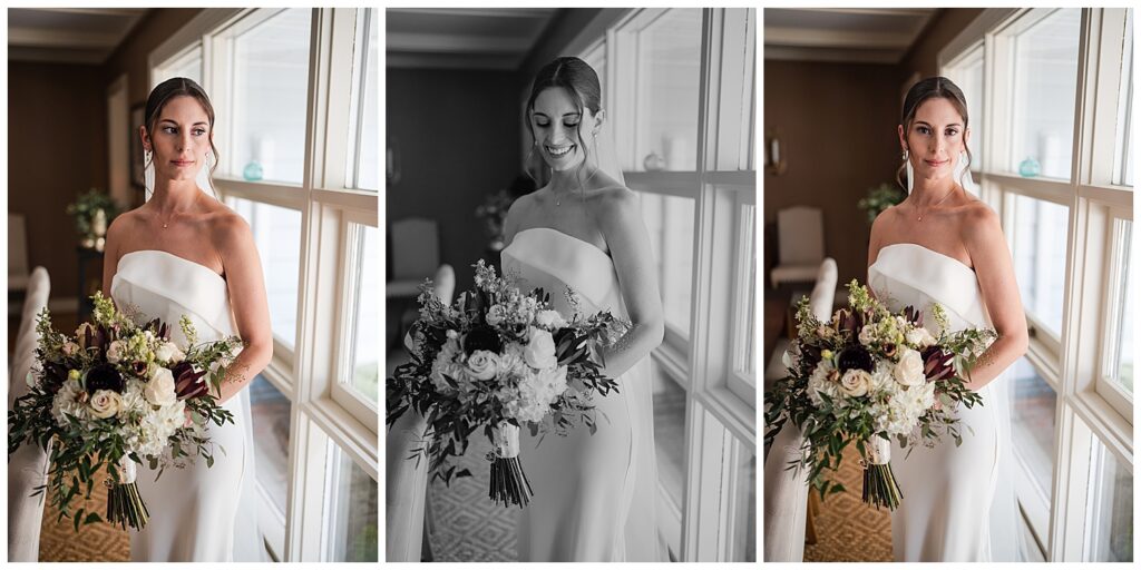 Portraits of the bride Emily standing by a window holding her wedding bouquet