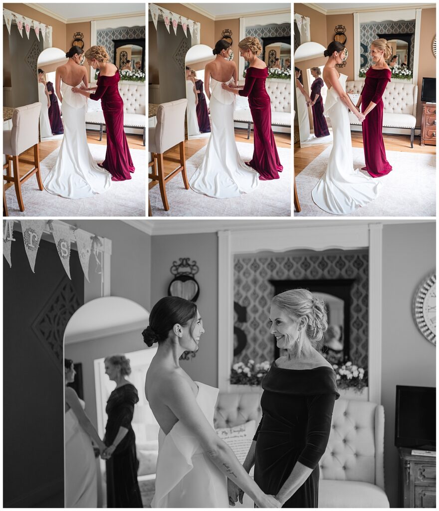 Brides mom helps her into her wedding dress