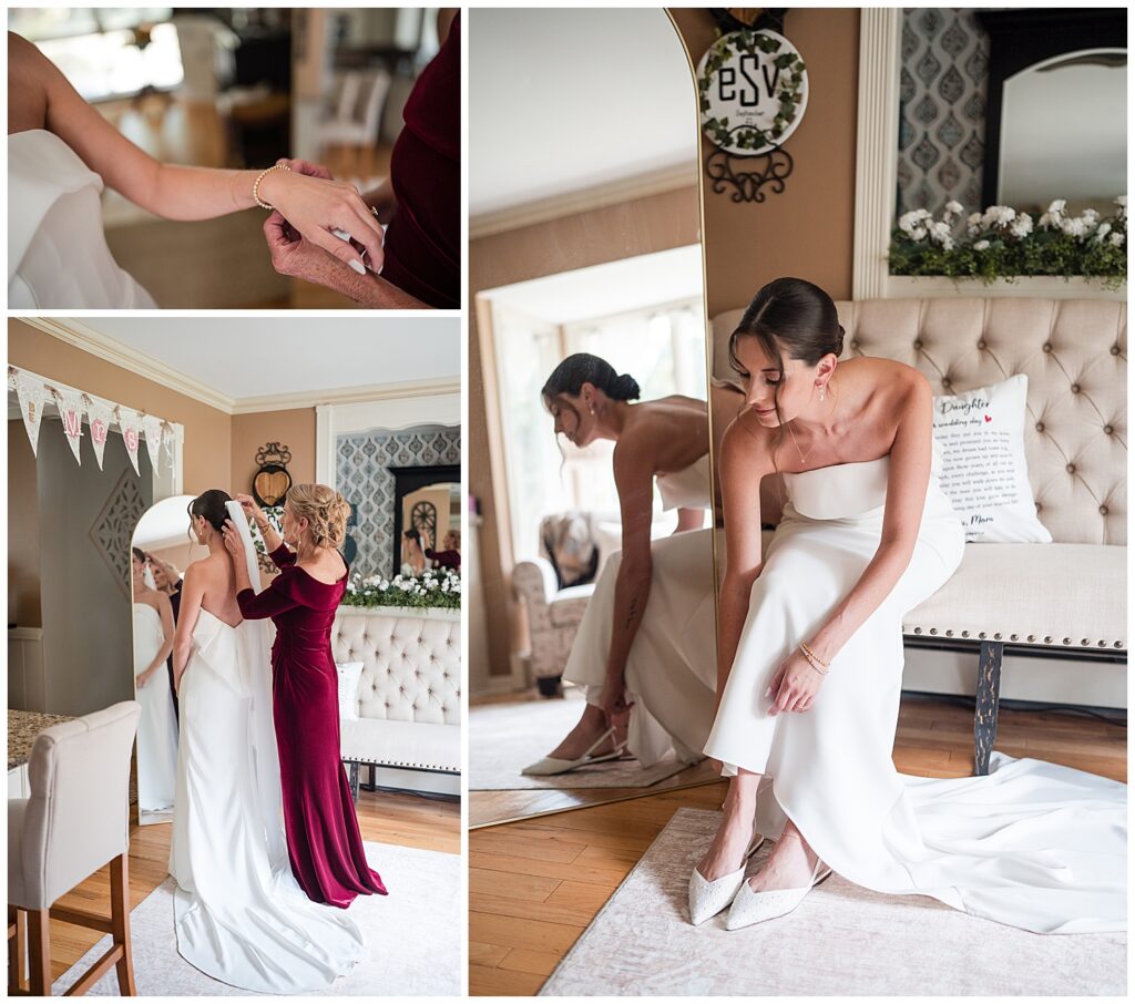 Bride puts on shoes while her mother helps her place her wedding veil into her hair.