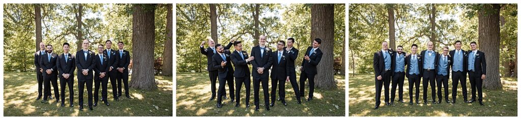 groom and groomsmen pose for formal photos on wedding day