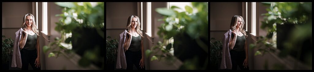 Jennifer poses next to window of the show at sheas seneca buffalo NY 